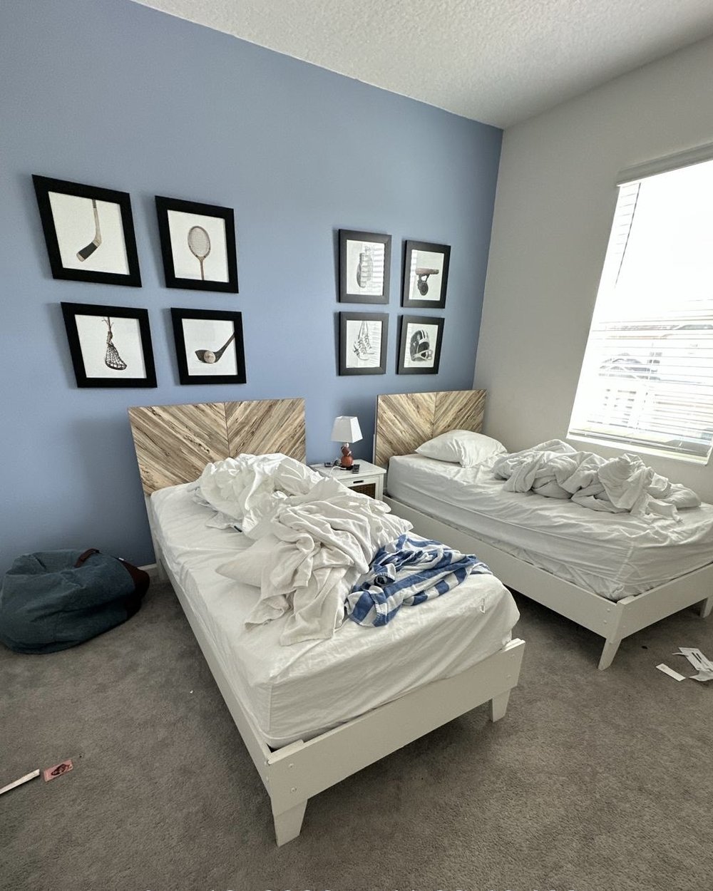 Before: the same twin bedroom, unmade beds and clutter