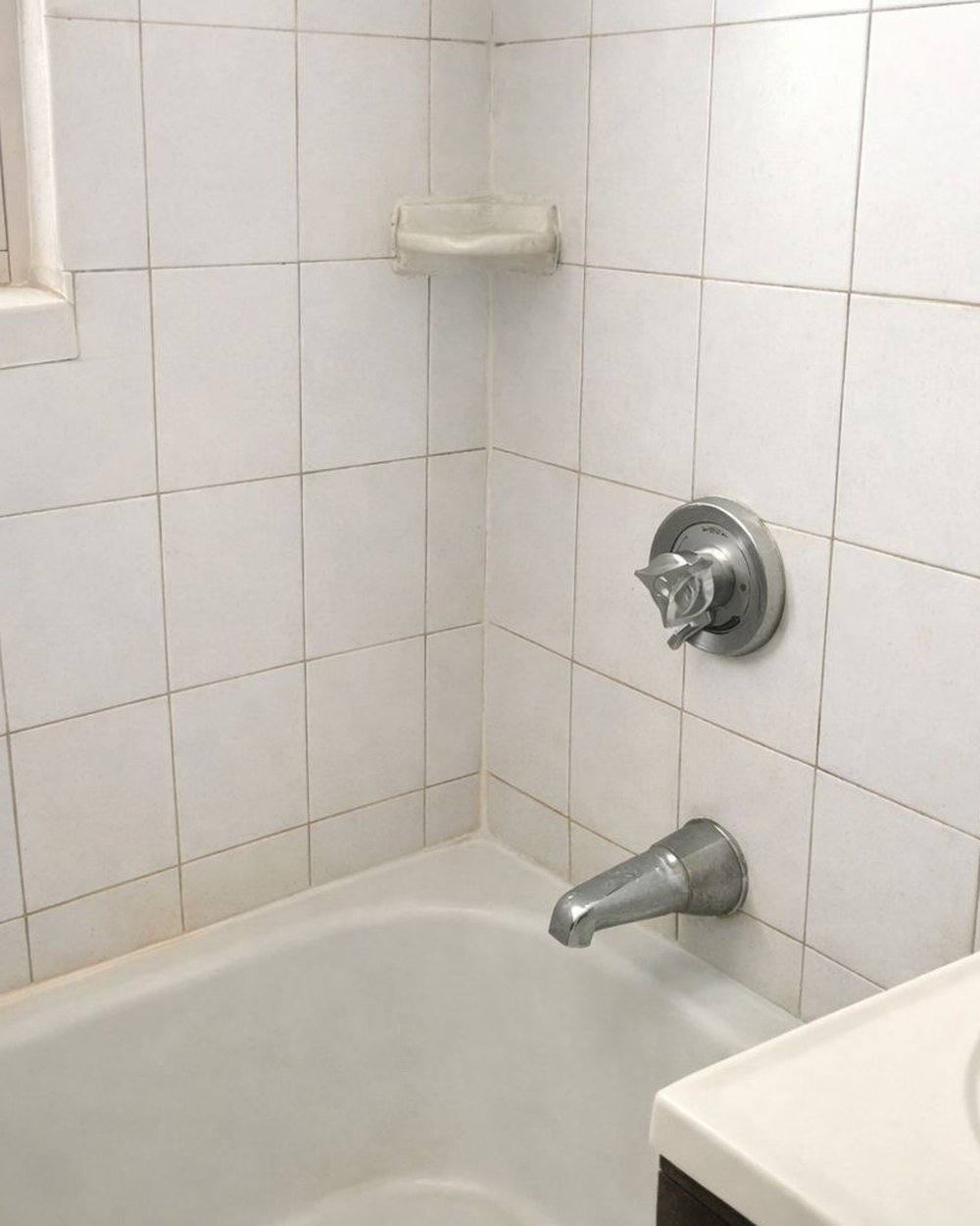 After: spotless shower tile, mould and soap scum gone